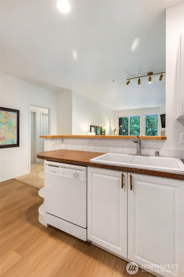 12712 Admiralty Way Unit B202, Everett, WA 98204 - kitchen with dishwasher, white cabinets, light wood-type flooring, and track lighting