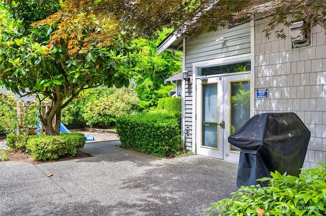 12712 Admiralty Way Unit B202, Everett, WA 98204 - view of patio featuring grilling area and french doors