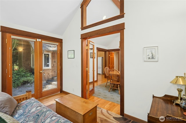 5579 NE Foster Rd, Bainbridge Island, WA 98110 - entryway with french doors, light wood finished floors, and high vaulted ceiling