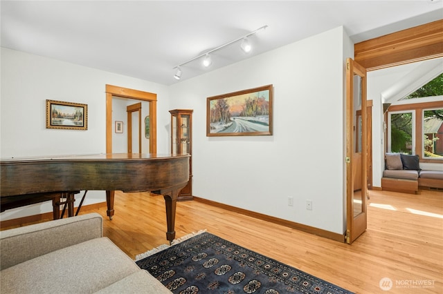 5579 NE Foster Rd, Bainbridge Island, WA 98110 - corridor featuring light wood-style floors and rail lighting