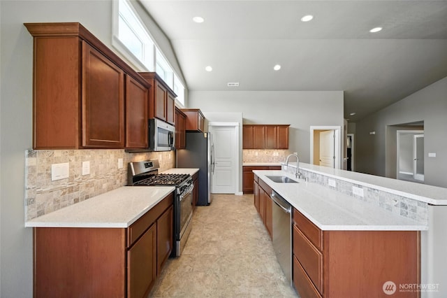 1330 Caprio Loop, Walla Walla, WA 99362 - kitchen with stainless steel appliances, backsplash, lofted ceiling, recessed lighting, and a large island