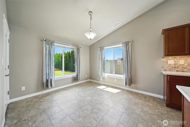 1330 Caprio Loop, Walla Walla, WA 99362 - unfurnished dining area with lofted ceiling and baseboards