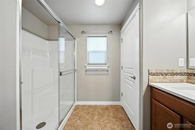 1330 Caprio Loop, Walla Walla, WA 99362 - bathroom featuring a stall shower, vanity, and decorative backsplash