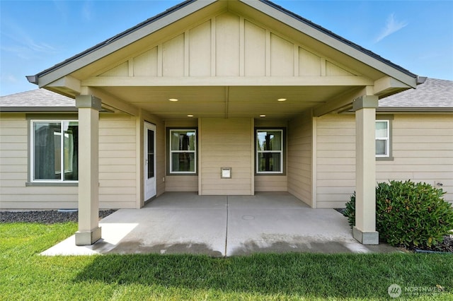 1330 Caprio Loop, Walla Walla, WA 99362 - rear view of property featuring a patio, board and batten siding, roof with shingles, and a lawn