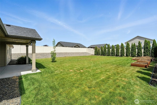1330 Caprio Loop, Walla Walla, WA 99362 - fenced backyard featuring a patio and a vegetable garden