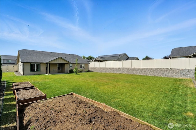 1330 Caprio Loop, Walla Walla, WA 99362 - fenced backyard featuring a garden