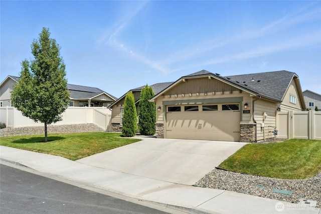 1330 Caprio Loop, Walla Walla, WA 99362 - view of front of property with stone siding, an attached garage, concrete driveway, roof with shingles, and board and batten siding