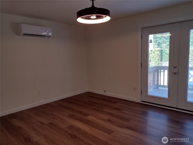 6245 S Huson St, Tacoma, WA 98409 - unfurnished dining area with an AC wall unit, french doors, and wood finished floors