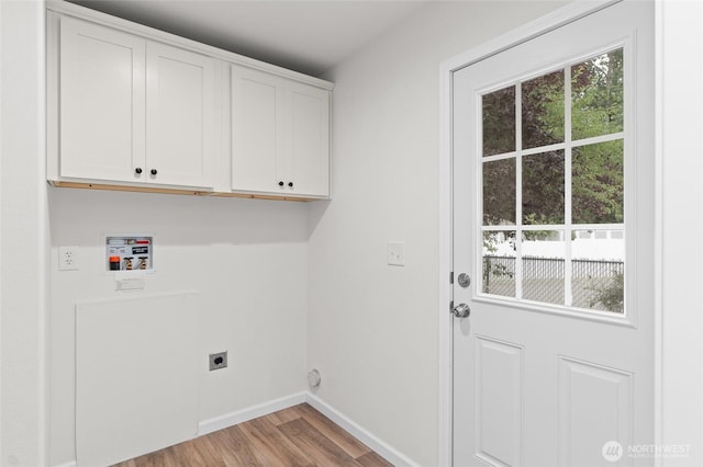 2120 77th Street Ct E, Tacoma, WA 98404 - washroom featuring electric dryer hookup, cabinet space, wood finished floors, and healthy amount of natural light