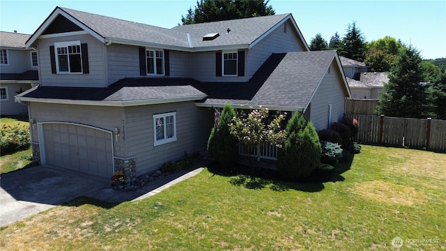 7106 201st St E, Spanaway, WA 98387 - traditional-style home featuring an attached garage, roof with shingles, and driveway