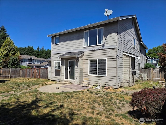 7106 201st St E, Spanaway, WA 98387 - rear view of property with a patio area and a fenced backyard