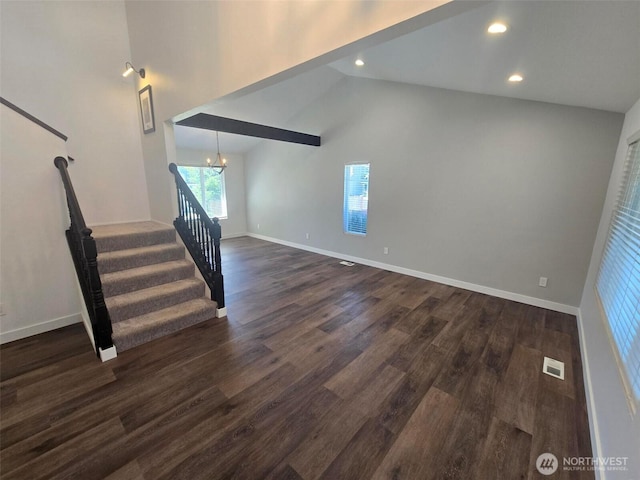 7106 201st St E, Spanaway, WA 98387 - unfurnished living room with dark wood finished floors, high vaulted ceiling, stairs, a chandelier, and recessed lighting