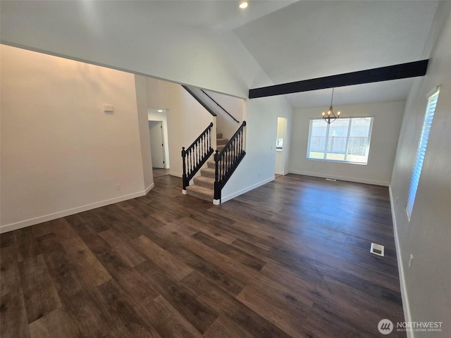 7106 201st St E, Spanaway, WA 98387 - unfurnished living room with a chandelier, stairs, lofted ceiling, and dark wood-style floors
