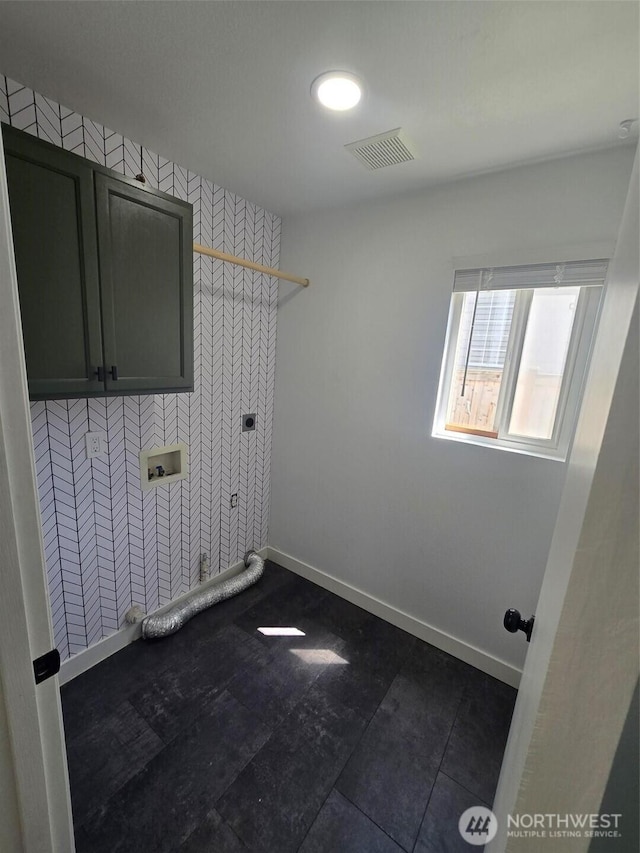 7106 201st St E, Spanaway, WA 98387 - washroom featuring cabinet space, electric dryer hookup, and wallpapered walls