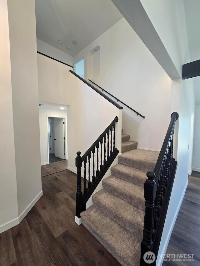 7106 201st St E, Spanaway, WA 98387 - stairs with wood finished floors and a towering ceiling