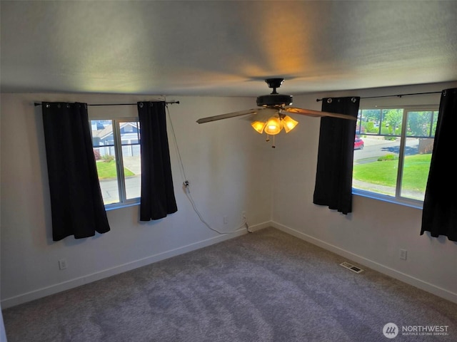 7106 201st St E, Spanaway, WA 98387 - empty room featuring a ceiling fan and carpet flooring