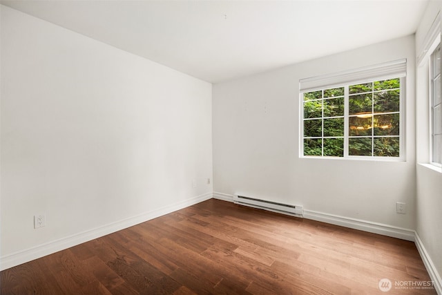 9822 NE 122nd St Unit U101, Kirkland, WA 98034 - empty room with baseboard heating and wood finished floors