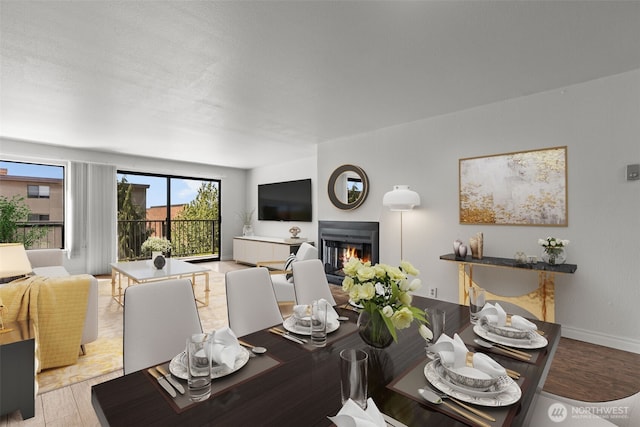 500 W Roy St Unit W103, Seattle, WA 98119 - dining room featuring a glass covered fireplace and baseboards