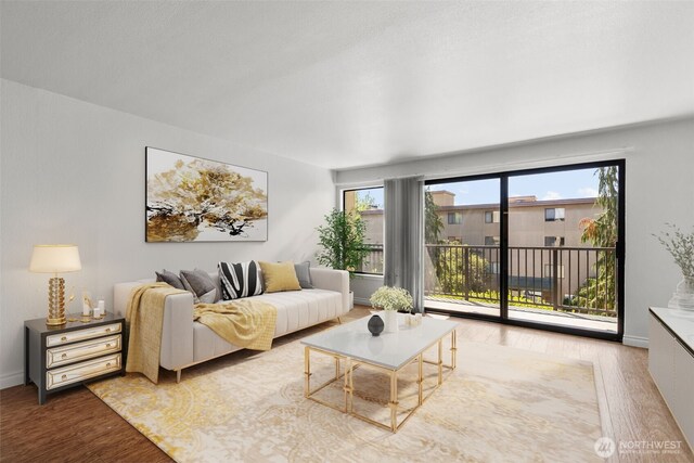 500 W Roy St Unit W103, Seattle, WA 98119 - living area featuring wood finished floors and baseboards