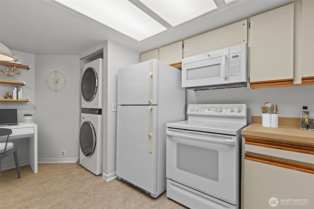 500 W Roy St Unit W103, Seattle, WA 98119 - kitchen featuring white appliances, estacked washer and dryer, light countertops, and open shelves