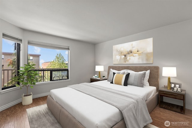 500 W Roy St Unit W103, Seattle, WA 98119 - bedroom featuring wood finished floors and baseboards