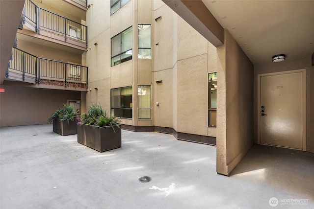 500 W Roy St Unit W103, Seattle, WA 98119 - view of exterior entry with stucco siding and a patio area