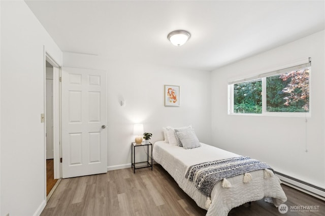 19520 Grannis Rd, Bothell, WA 98012 - bedroom featuring a baseboard radiator and light wood-style flooring