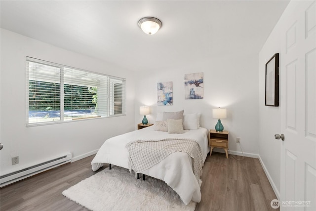 19520 Grannis Rd, Bothell, WA 98012 - bedroom with a baseboard radiator and wood finished floors