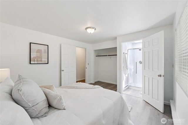 19520 Grannis Rd, Bothell, WA 98012 - bedroom featuring wood finished floors, a closet, and ensuite bathroom