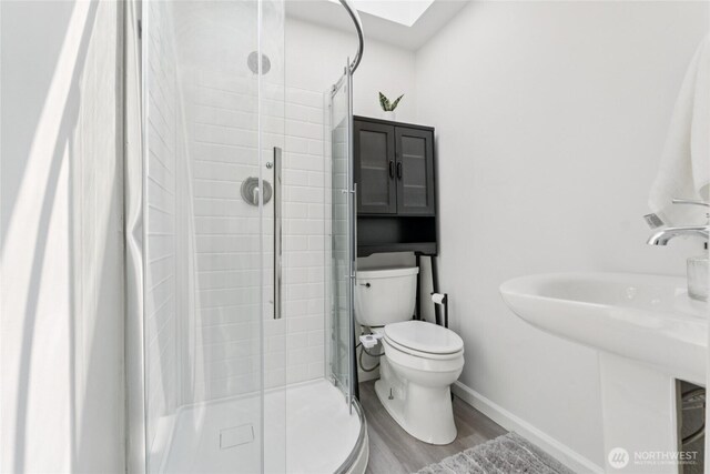 19520 Grannis Rd, Bothell, WA 98012 - full bath with a shower stall and wood finished floors