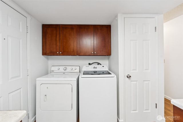 19520 Grannis Rd, Bothell, WA 98012 - laundry room featuring cabinet space, independent washer and dryer, and wood finished floors