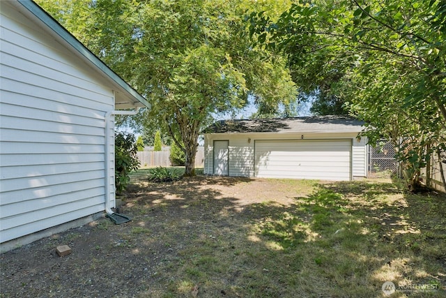 19520 Grannis Rd, Bothell, WA 98012 - view of yard with an outdoor structure and a detached garage