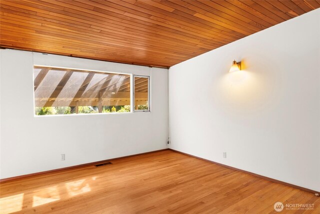 4728 86th Ave SE, Mercer Island, WA 98040 - empty room with wooden ceiling and wood finished floors
