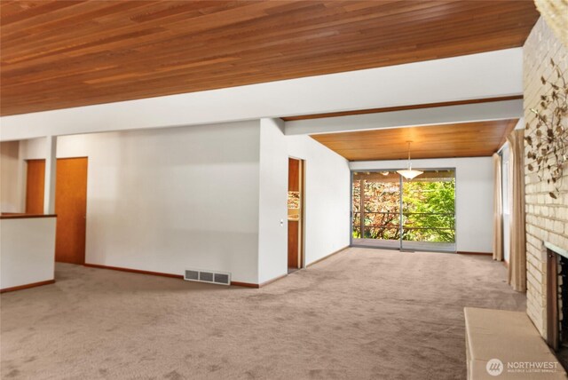 4728 86th Ave SE, Mercer Island, WA 98040 - unfurnished living room featuring carpet floors, a large fireplace, and wood ceiling