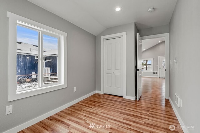 970 9th Ave, Longview, WA 98632 - unfurnished bedroom featuring lofted ceiling, multiple windows, light wood finished floors, a closet, and recessed lighting