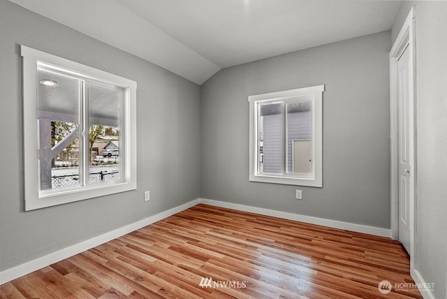970 9th Ave, Longview, WA 98632 - unfurnished bedroom with wood finished floors, lofted ceiling, and a closet