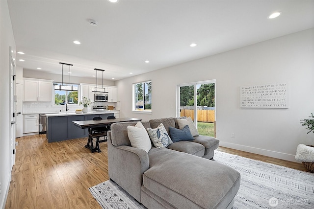 10111 12th Ave E, Tacoma, WA 98445 - living room featuring recessed lighting and light wood-style floors