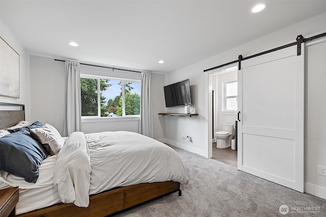 10111 12th Ave E, Tacoma, WA 98445 - carpeted bedroom featuring a barn door, recessed lighting, and ensuite bathroom