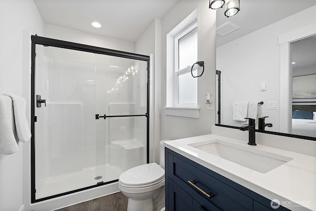 10111 12th Ave E, Tacoma, WA 98445 - full bath with a shower stall, vanity, wood finished floors, and recessed lighting