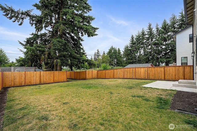 10111 12th Ave E, Tacoma, WA 98445 - fenced backyard featuring a patio area