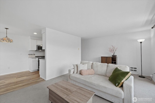 2448 NW 59th St Unit 301, Seattle, WA 98107 - living area with recessed lighting and light carpet