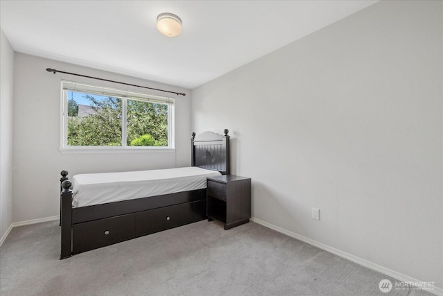 2448 NW 59th St Unit 301, Seattle, WA 98107 - bedroom with baseboards and light carpet