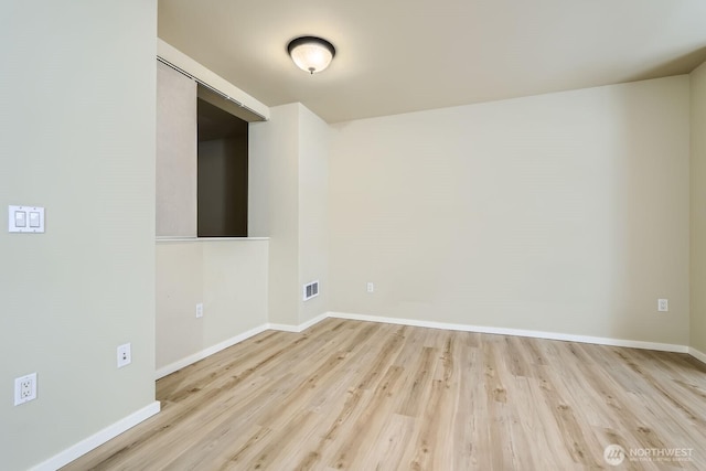 76 Cedar St Unit 806, Seattle, WA 98121 - empty room featuring wood finished floors and baseboards