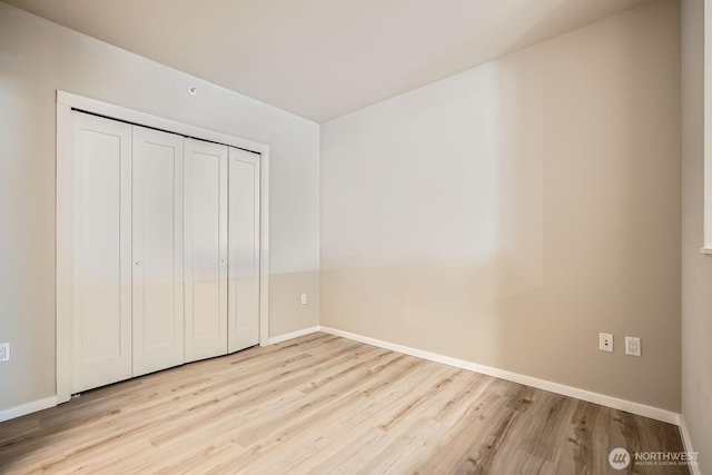 76 Cedar St Unit 806, Seattle, WA 98121 - unfurnished bedroom featuring wood finished floors and a closet