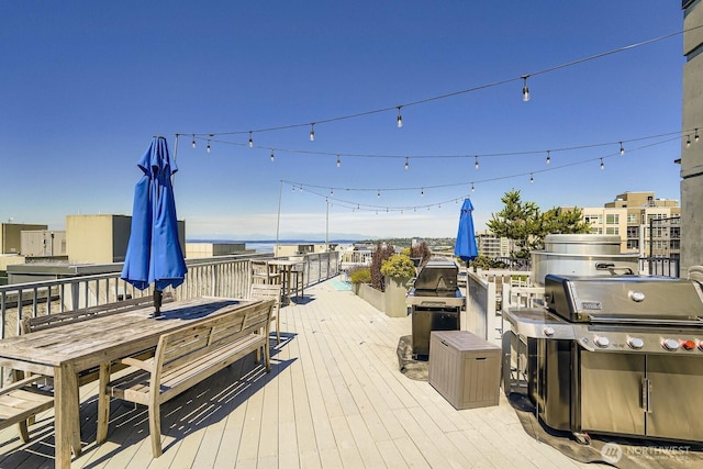 76 Cedar St Unit 806, Seattle, WA 98121 - wooden deck with grilling area and outdoor dining area