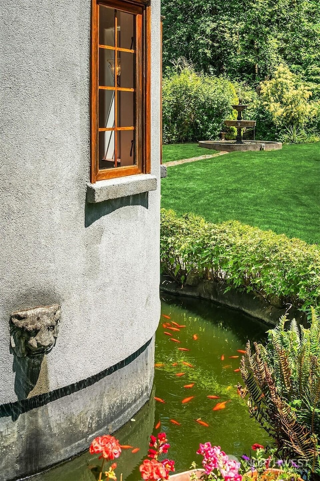 24917 Dockton Rd SW, Vashon, WA 98070 - exterior view of stucco siding and a small pond