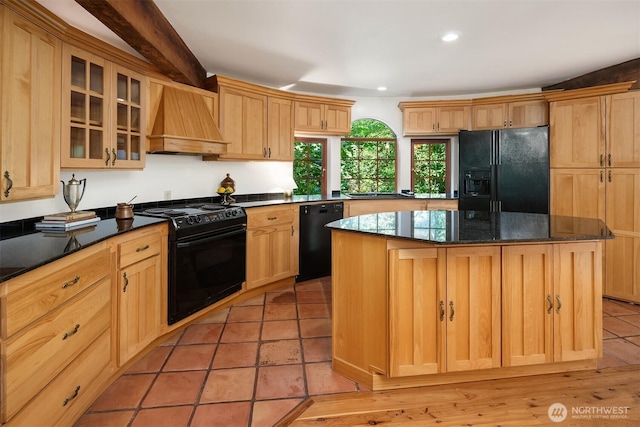 24917 Dockton Rd SW, Vashon, WA 98070 - kitchen with black appliances, premium range hood, a center island, glass insert cabinets, and recessed lighting