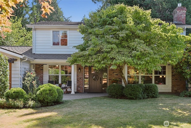 4712 90th Ave SE, Mercer Island, WA 98040 - view of front of property with a front yard, a shingled roof, a porch, and brick siding