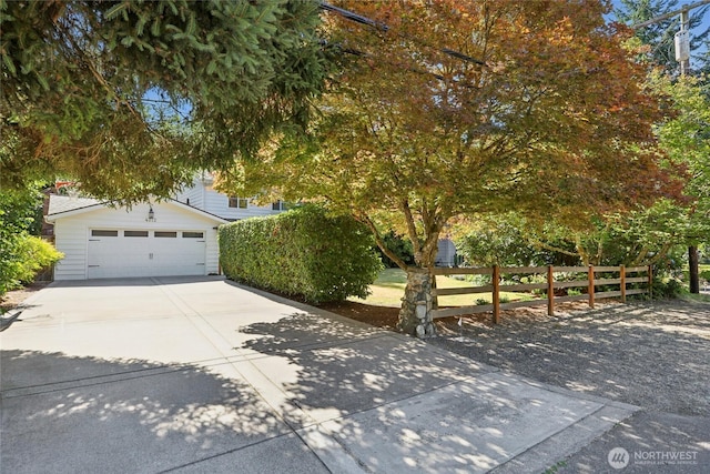 4712 90th Ave SE, Mercer Island, WA 98040 - view of property hidden behind natural elements with concrete driveway