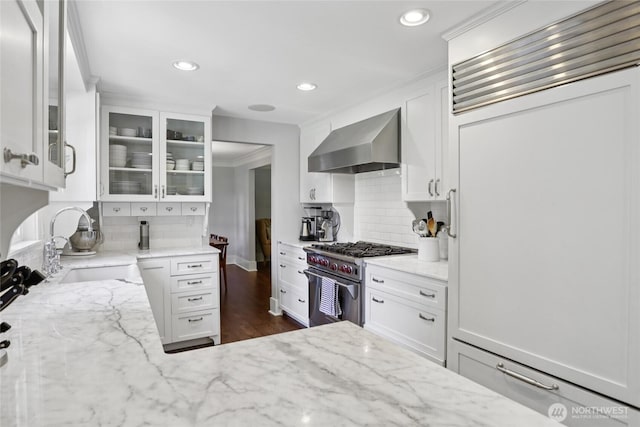 4712 90th Ave SE, Mercer Island, WA 98040 - kitchen with wall chimney range hood, high end stainless steel range oven, tasteful backsplash, glass insert cabinets, and light stone counters